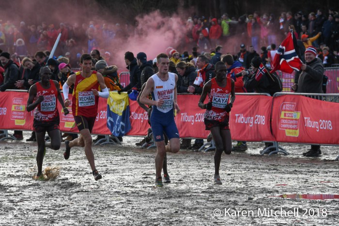 leaders run through the mud as fans light flares-8497